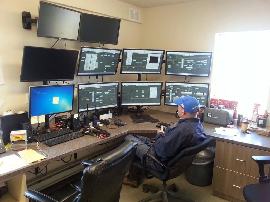 Man working with many monitors